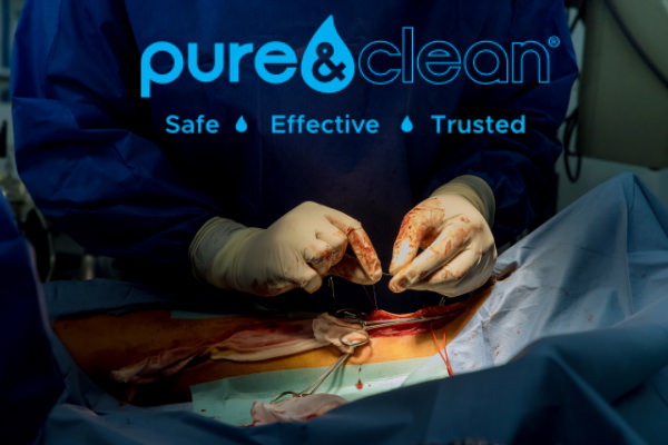Surgeon begins to sew the wound on the leg after the operation